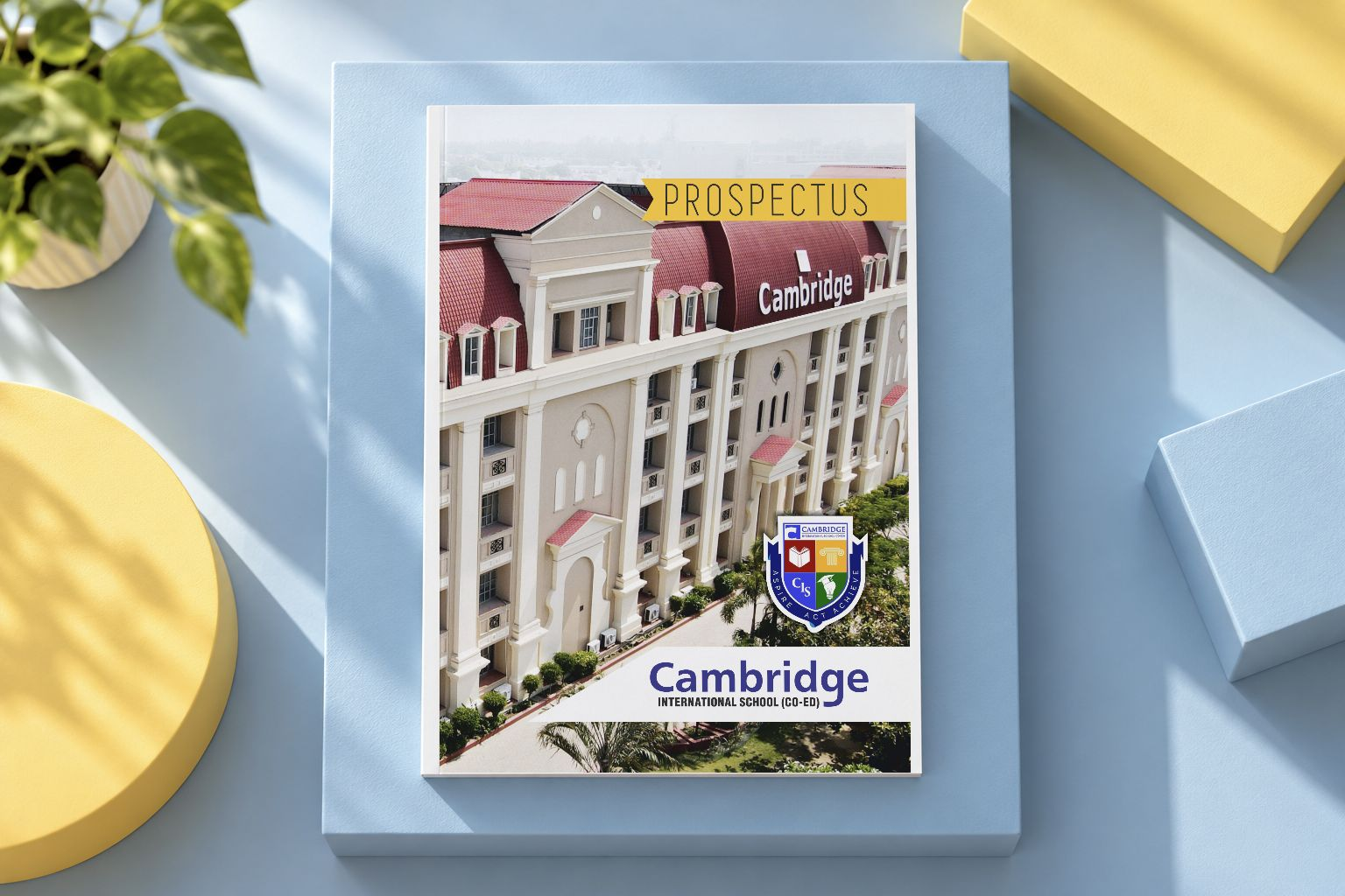 Cambridge International School prospectus cover in a blue and yellow presentation