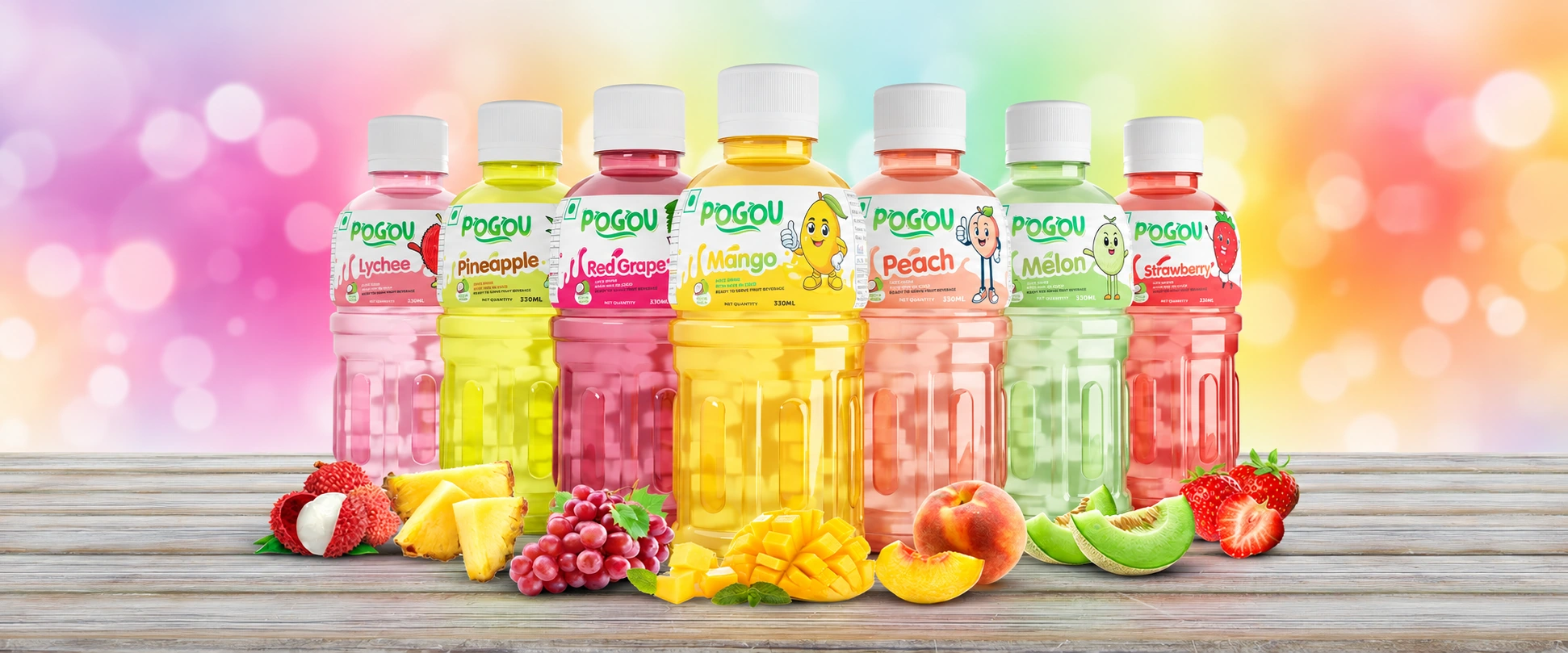 The complete Pogou fruit drink range with colourful labels and fresh fruit
